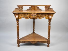 A Late 20th Century Stained Oak Two Tier Corner Table with Pierced Galleried Top and Turned