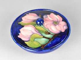 A Moorcroft Circular Pot and Cover, Hibiscus Pattern on Blue Ground, 16cm diameter