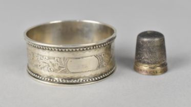 A Silver Napkin Ring by HB, Birmingham Hallmark 1892 Together with a Sterling Silver Thimble