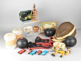 A Collection of Sundries to Include Three Lawn Bowls, Fencing Helmet, Miniature Spinning Wheel etc