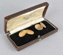 A Pair of Cased 9ct Gold Cufflinks, Oval Panels Measuring 16mm by 11.5mm, One Side with Machine