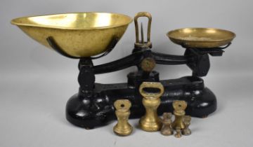 A Set of Modern Black Enamelled Brass Mounted Kitchen Scales