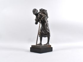 A Bronze Figural Study of Arab Water Carrier with Flask and Staff Set on Rectangular Wooden