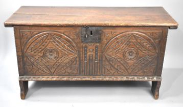 An Oak Sword Chest with Hinged Lid and Carved Front Panel, 102cms Wide