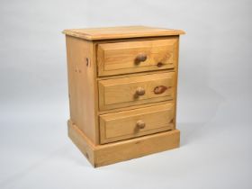 A Modern Pine Three Drawer Bedside Chest, 48cms Wide