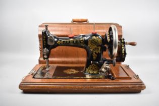 A Manual Cased Jones Sewing Machine