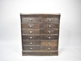 An Edwardian Globe Wernicke Twelve Drawer Base Unit, 70cms Wide and 35cms Deep and 79.5cms High