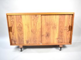 A 1970's Side Cabinet on Casters with Sliding Doors, 120cm wide