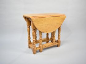 A Modern Small Pine Drop Leaf Gate Leg Table, 54cms Long