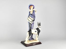 A 1997 Capodimonte Figure of Maiden with Dog on Wooden Plinth, 47cms High