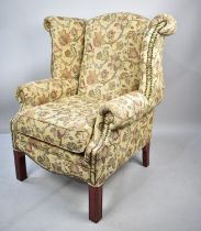 A Tapestry Upholstered Wing Armchair