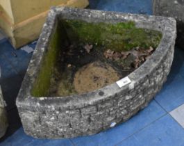 A Reconstituted Stone Triangular Bow Fronted Planter, 56cm wide