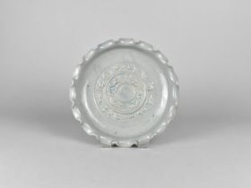 A Chinese Celadon Brush Washer/Dish with Wavy Rim Decorated in Shallow Relief with Dragons and