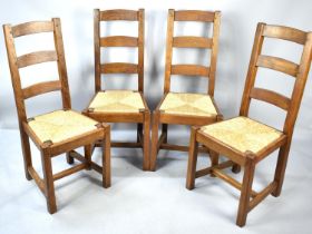 A Set of Four Rush Seated Ladderback Dining Chairs