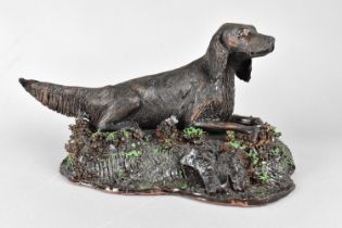 A Glazed Studio Pottery Terracotta Study of a Reclining Setter, Naturalistic Base, 31cms Wide