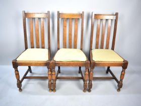 A Set of Three Edwardian Oak Dining Chairs