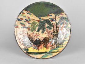 An Oriental Crackle Glazed Dish Decorated in Polychrome with Village Scene Decoration and Oxidised