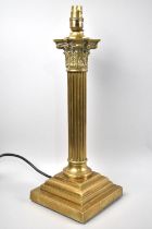 A Heavy Brass Table Lamp in the Form of a Reeded Corinthian Column on Stepped Base, No Shade,