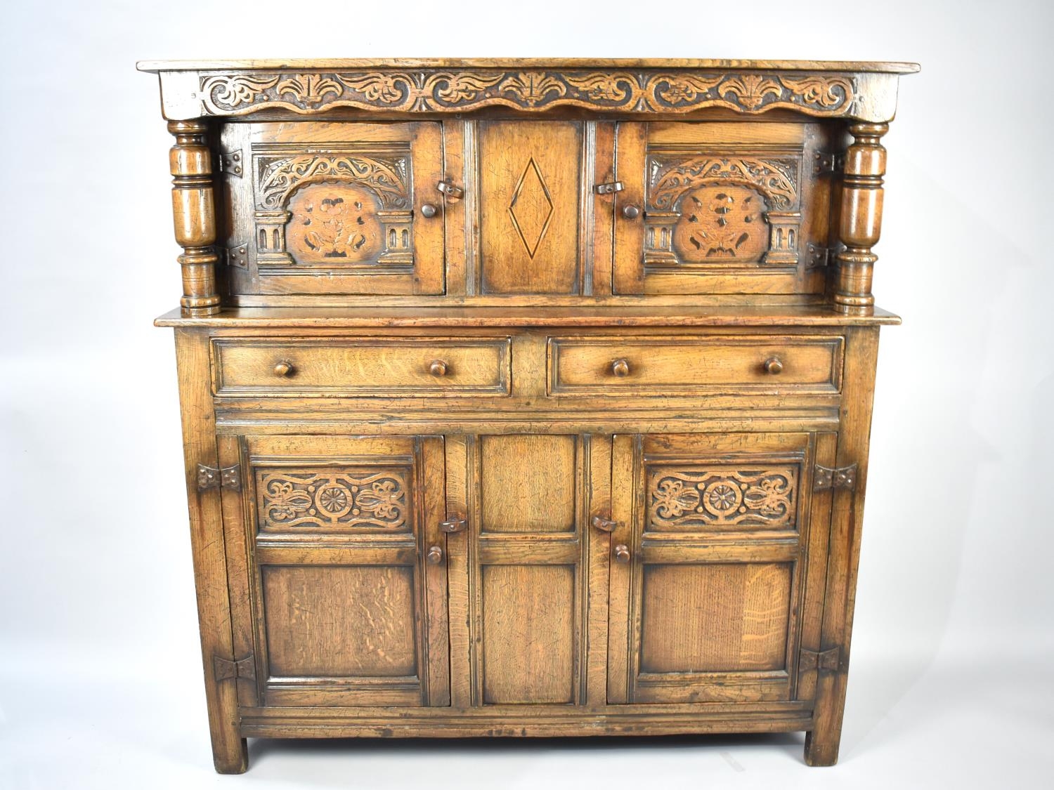 A Nice Quality Oak Court Cupboard with Two Drawers to Base, Raised Top Section with Inlaid Panel