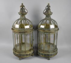 A Pair of Green Patinated Brass Circular Lanterns with pierced Base and Four Claw Feet, 62cms High
