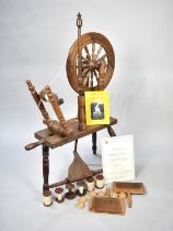 A Mid/Late 20th Century Oak Spinning Wheel with Accessories, Carding Combs and Certificate