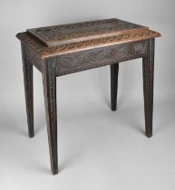 An Edwardian Carved Oak Stool on Tapering Square Supports, 52cms by 32cms and 56cms High