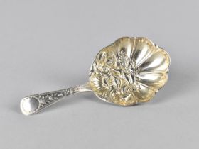 A 19th Century Silver Caddy Spoon with Chased Handle and Shell Shaped Bowl with Repousse Scrolls,