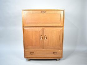 An Ercol Side Cabinet with Pull Down Front, Cupboard Centre, Long Drawer to Base together with Three