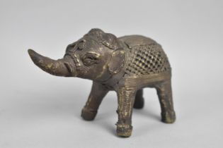 An Indian Brass Temple or Altar Figure of an Elephant with Trunk Raised, 11cms Long