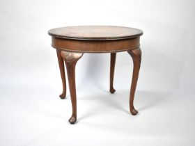 An Edwardian Walnut Circular Coffee Table on Cabriole Supports, 61cms Diameter