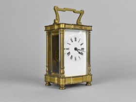 An Early/Mid 20th Century French Brass Carriage Clock with White Enamelled Dial with Key and