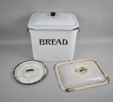 A Vintage White Enamel Bread Bin and Two Lids