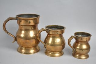 A Set of Three Georgian Style Brass Graduated Measures, Tallest 13.5cms