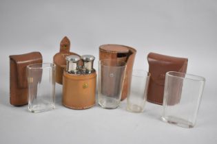 A Collection of Four Vintage Leather Cased Glass Flask Sets of Cylindrical and Rectangular Form,