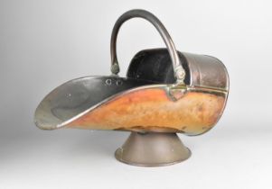 A Late 19th Century Copper Helmet Shaped Coal Scuttle