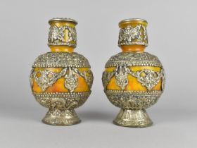 A Pair of White Metal Mounted Faux Amber Vases decorated in Relief with Animals and Flowers, 20cms