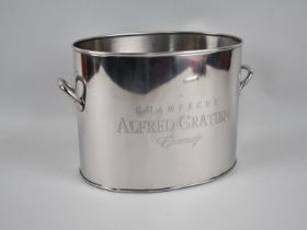 A Two Handled Silver Plated Oval Champagne Cooler, 28cms Wide and 19cms High