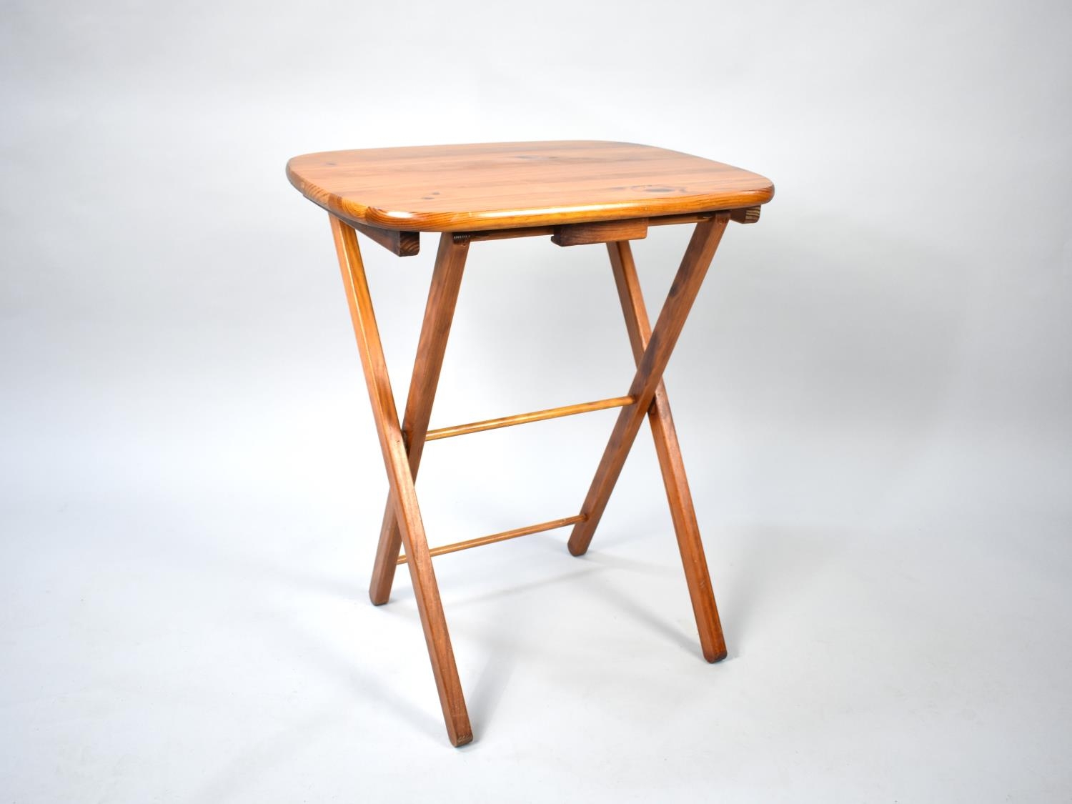 A Modern Stained Pine Folding Table, 54cms Wide
