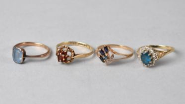 Four 9ct Gold and Jewelled Mounted Dress Rings to include Garnet, Topaz, Sapphire and Diamond