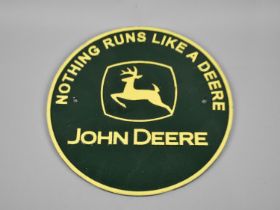 A Reproduction Cold Painted Cast Metal Circular Sign for John Deere, 24cms Diameter