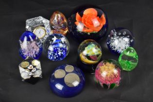 A Collection of Various Glass Paperweights