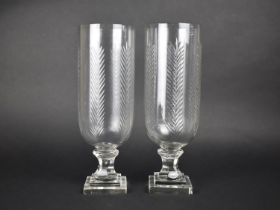 A Pair of Tall Glass Hurricane Lamps, 34.5cms High