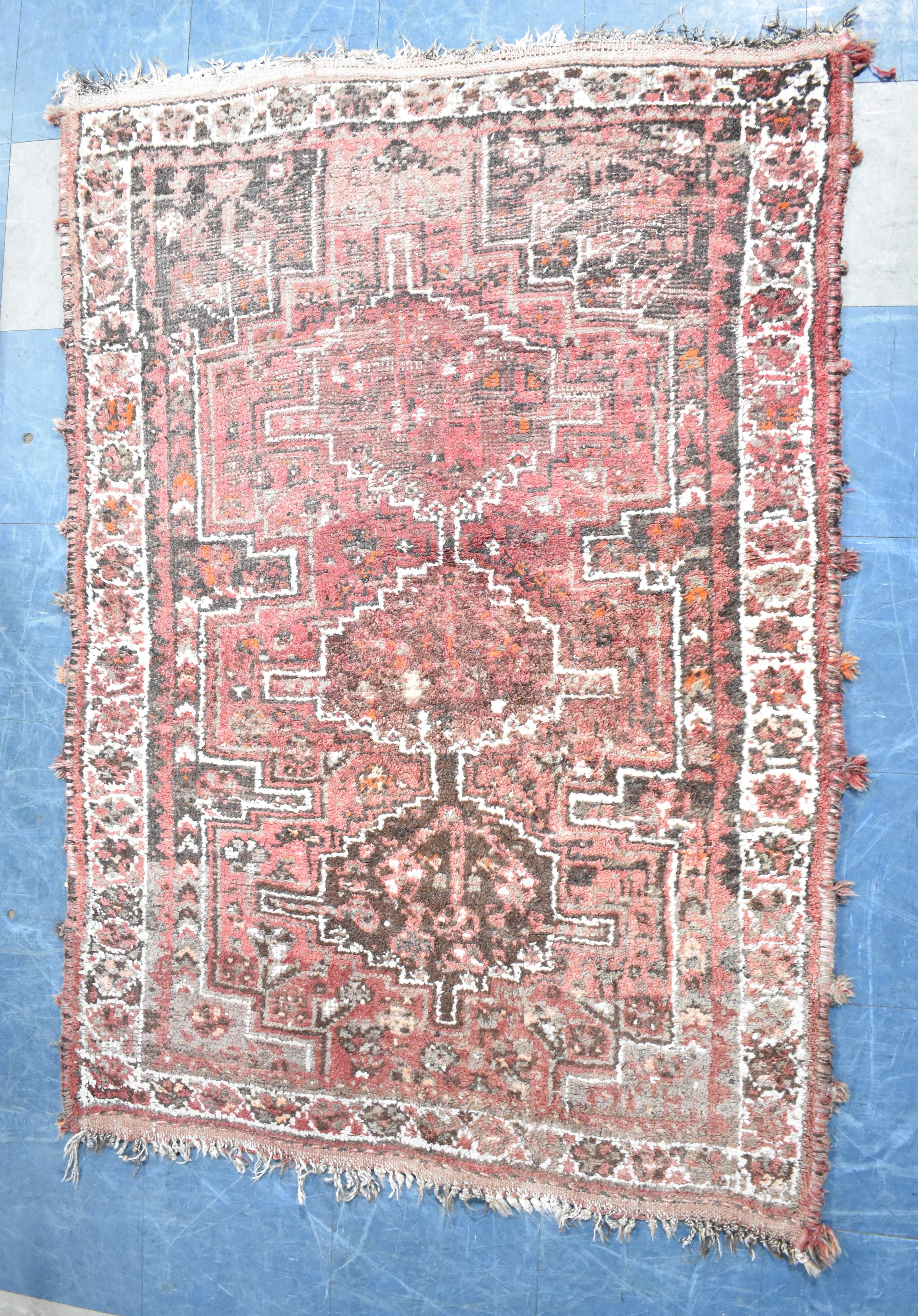 A Patterned Woolen Rug, Somewhat Worn, 157x114cms