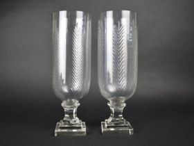 A Pair of Tall Glass Hurricane Lamps, 34cms High