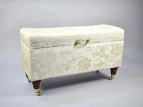 A Modern Upholstered Blanket Box with Hinged Lid, Turned Wooden Feet with Brass Castors, 92cms Wide