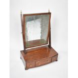 A 19th Century String Inlaid and Crossbanded Mahogany Dressing Table Swing Mirror with Bow Fronted