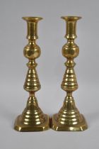 A Pair of Victorian Brass Candlesticks with Pushers, 28cms High
