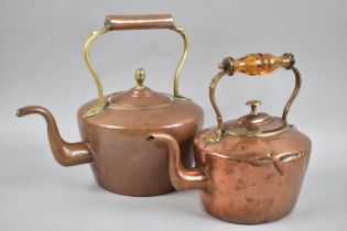 Two Copper Kettles, one with Amber Glass Handle, Other with Acorn Finial