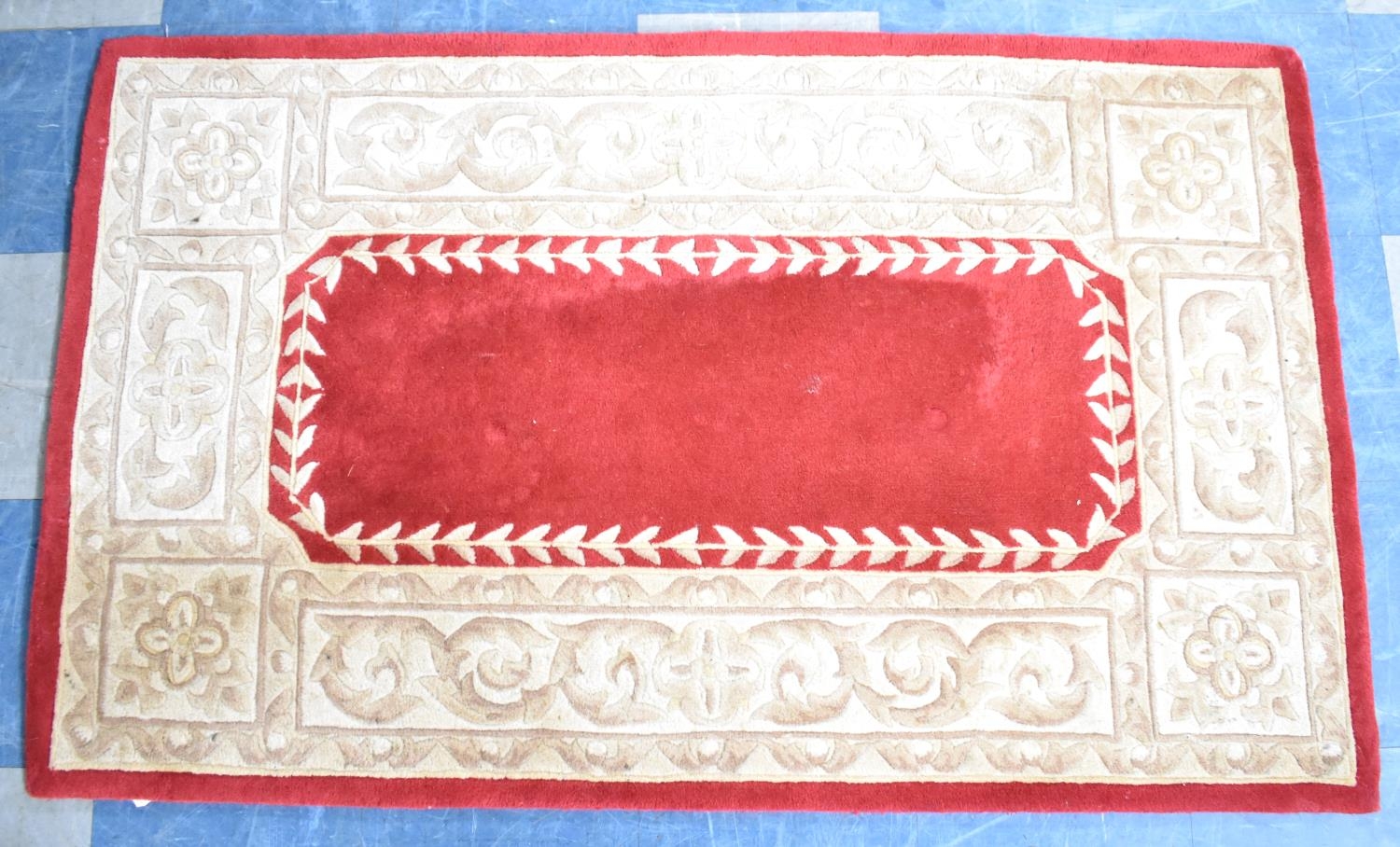 A Modern Patterned Rug on Red Ground, 150x92cms