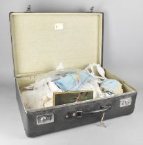 A Vintage Case Containing Various Table Linens Etc